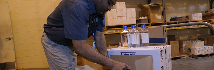 Employee packing items in a box