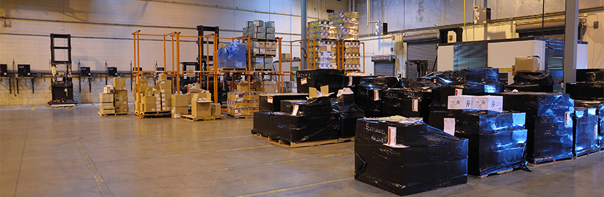 Section of the Supply Center ware house with boxes neatly stacked